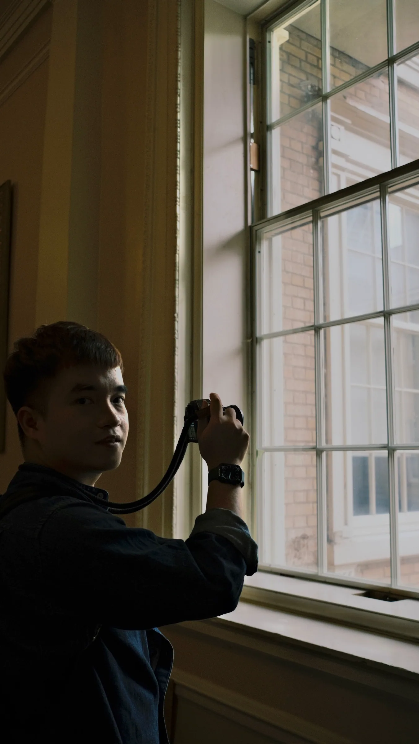 A person looking out a window